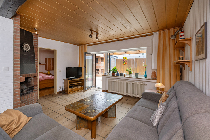 Wohnzimmer mit Zugang auf die Terrasse